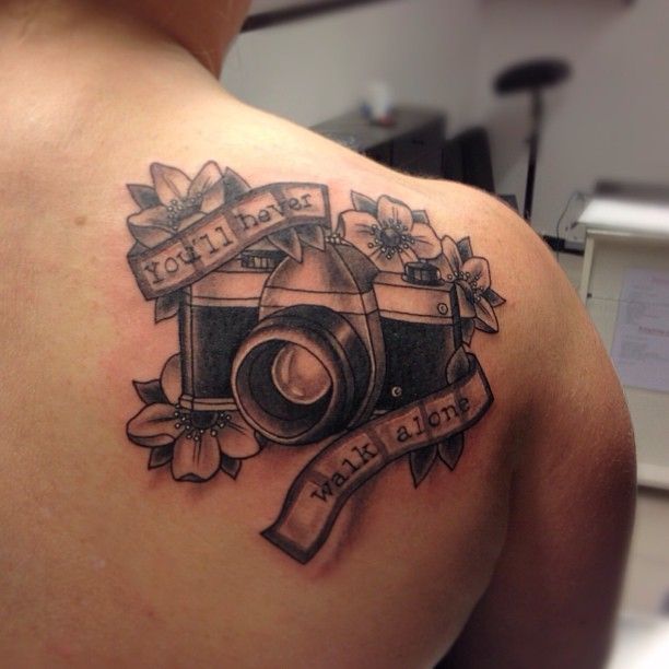 Camera With Flower Tattoo On Right Back Shoulder Love this! u003c3 MCP