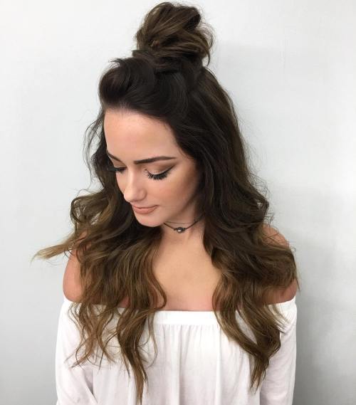 Add texture to your half bun by using a curling wand to achieve