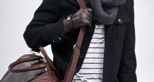 Grey infinity scarf, b/w shirt under a black coat accessorized with