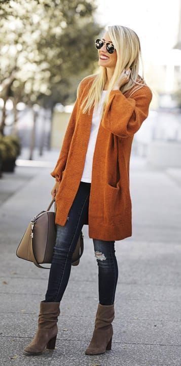Fall/winter orange coat with blue dark jeans, steet style outfit for