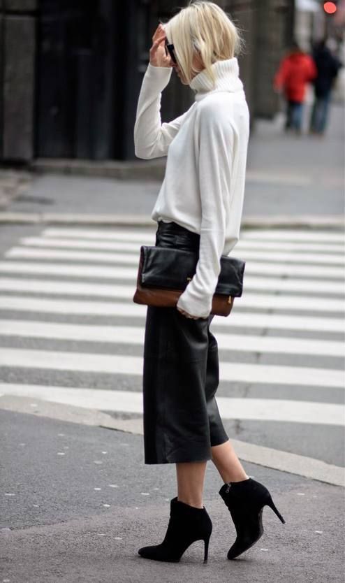 Leather culottes with white turtleneck sweater and black heeled