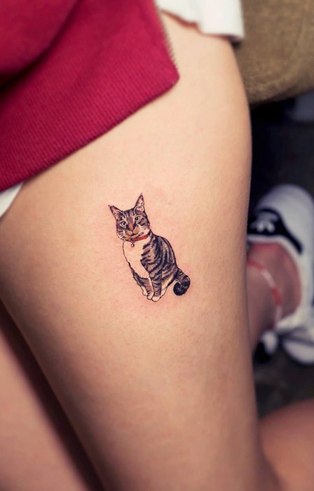 Cute Small Cat Tattoo On Girl's Thigh