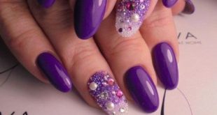 ultra violet manicure with bold accent nails with rhinestones
