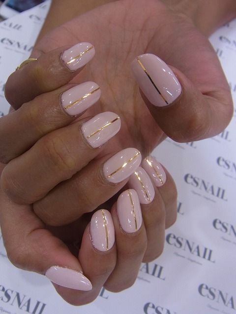 Nails with one gold strip on pink background----repinned by acb