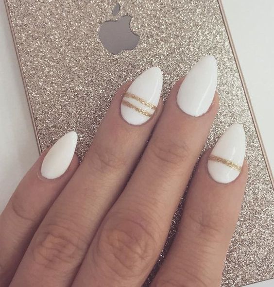 Picture Of white nails with gold glitter thin stripes