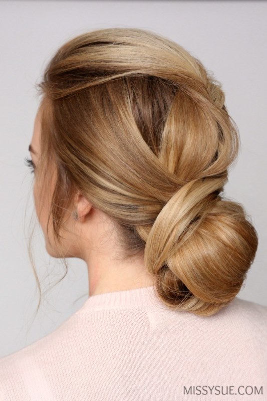 Picture Of sophisticated diy wrapped low bun hair updo 2